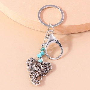 Bohemian retro silver alloy elephant keychain featuring turquoise beads and detailed engraving
