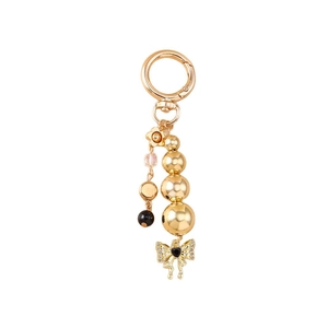 Golden gradient bead keychain with diamond bow and heart pendant on white background