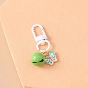Detail of multi-color enamel butterfly pendant with green bell and lobster clasp