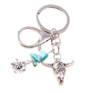Vintage bohemian keychain with turquoise stone, sunflower charm and bull skull pendant