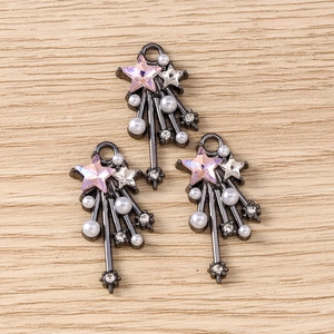 Y2K star charms with pink rhinestones and pearls on a vintage black alloy base