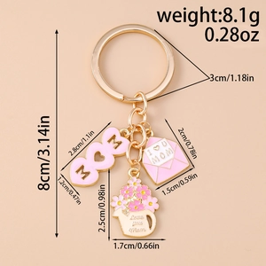 Detailed view of pink enamel MOM heart keychain with size markings and weight data