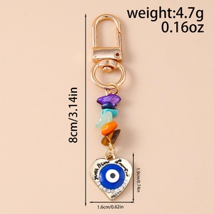 Detail of heart evil eye keychain with rhinestones and multi-color gemstones, 8cm length