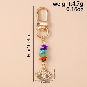 Detailed view of evil eye keychain with colorful crushed stones and size dimensions