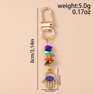 Detail of Hamsa Hand and Evil Eye keychain with colorful natural chakra stones and size specs