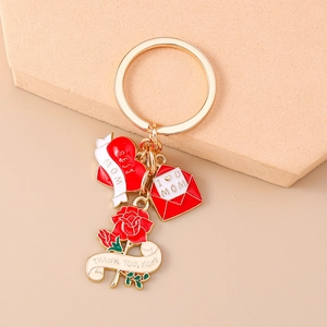 Detail of MOM keychain featuring heart, envelope and rose pendants for Mother's Day gift