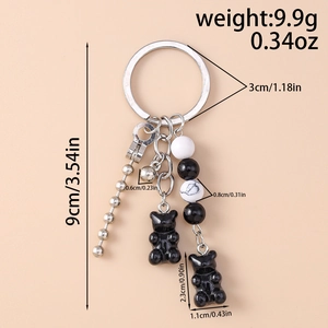 Detail view of bear keychain with dimensions 9cm total length and 9.9g weight