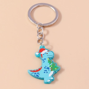 Detailed macro view of a glittery blue acrylic Christmas dinosaur keychain with metal ring