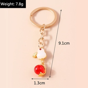 Detail showing dimensions of cute rabbit keychain with white pendant and gold metal ring