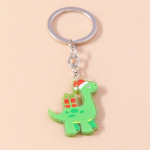 Detail of Christmas green dinosaur keychain with red hat and silver metal ring
