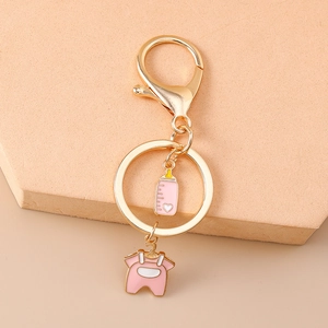 Pink cartoon baby bottle and onesie keychain with light gold metal lobster clasp