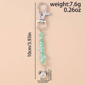 Detail view of turtle keychain with dimensions 10cm length and 7.6g weight metrics