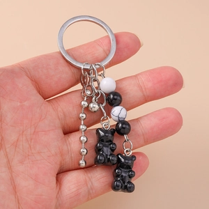 Fashionable keychain with black resin bears and marble texture beads on silver metal ring