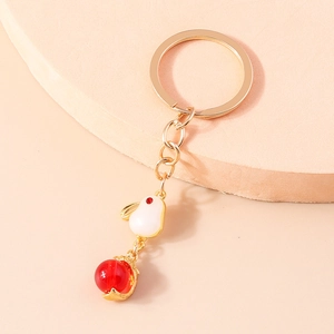 Cute bunny keychain with white rabbit charm, red bead and golden metal ring for women