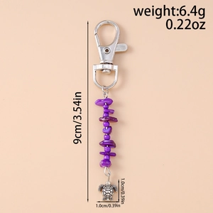 Detail view of purple stone sea turtle keychain with 9cm length and silver lobster clasp