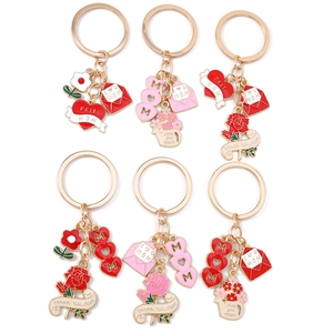 Golden Mother's Day keychain set with heart charms, roses and Mom engraved pendants