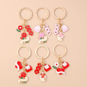 Golden Mother's Day keychain set with MOM hearts, rose flowers and enamel charms