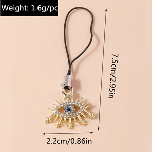 Detail of evil eye charm with rhinestones showing dimensions 7.5cm by 2.2cm and 1.6g weight