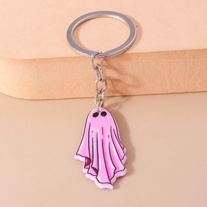 Close-up of a cute pink ghost keychain with silver metal ring for Halloween decor