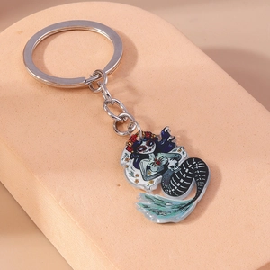 Macro view of mermaid skeleton keychain with colorful Day of the Dead flower patterns