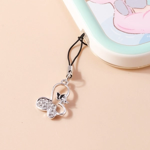 Exquisite hollow butterfly phone charm with sparkling rhinestones and black bow detail