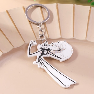 Detail of Jack Skellington acrylic keychain with silver metal ring on beige background
