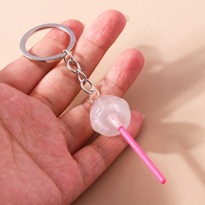 Detailed macro view of creative animal lollipop keychain with pink glitter resin finish