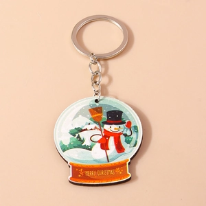 Détail d'un porte-clés bonhomme de neige de Noël avec texte Merry Christmas gravé