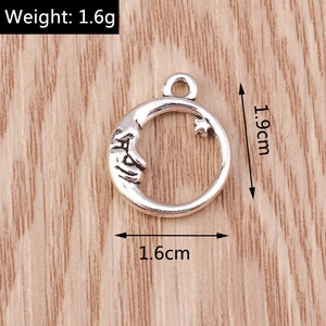 Macro detail of retro moon face and star alloy pendant with size markings 1.6x1.9cm