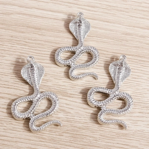 Three silver cobra snake charms with detailed scales for jewelry making and keychains