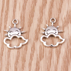 Detailed view of sun and cloud smiling face charms in antique silver alloy finish