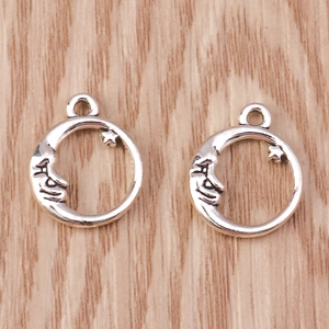Detail of vintage silver moon and star metal alloy charms for DIY jewelry making