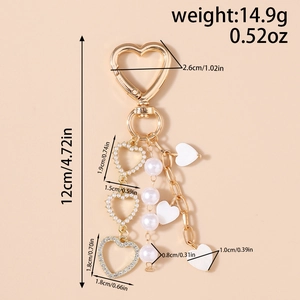 Detailed view of heart keychain measurements showing 12cm length and pearl bead charms