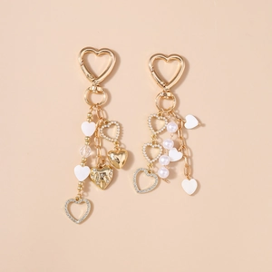 Golden heart keychain with white pearls, rhinestones and charms for backpacks