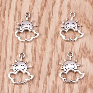 Detailed close-up of smiling sun and cloud silver alloy pendants for DIY jewelry crafts