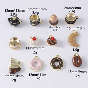Detailed grid view of food-themed enamel charms including teapot, cupcake, and donut charms