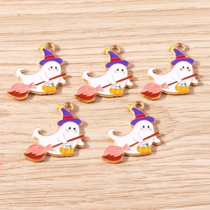 Detail of five cartoon ghost charms with wizard hats and pumpkins for DIY jewelry making