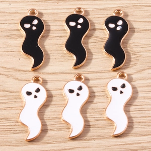 Detailed view of Halloween ghost charms with black and white enamel and gold plating