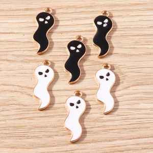 Detailed view of Halloween ghost charms with gold-plated edges and enamel finish