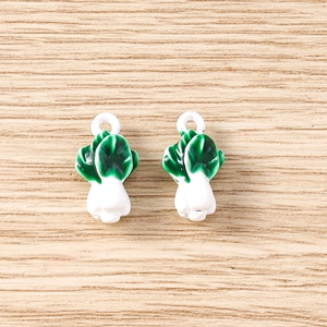 Close-up of realistic cabbage-shaped charms for DIY jewelry making and keychains