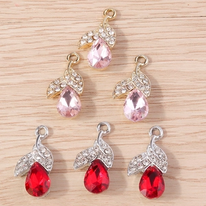 Detailed view of colorful teardrop crystal charms with wing design for DIY jewelry making