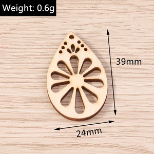 Detail of teardrop wooden pendant with flower cutout 39mm height for DIY jewelry making