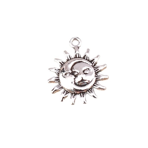 Vintage silver sun and moon celestial pendant with relief facial details for DIY jewelry