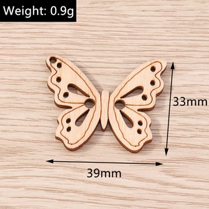 Detail view of 39x33mm wooden butterfly charm with intricate hollow carvings for DIY jewelry