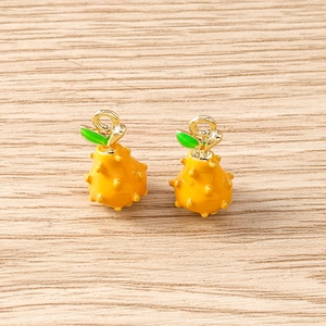 Realistic yellow tropical fruit pendants with green leaf details and golden metal rings
