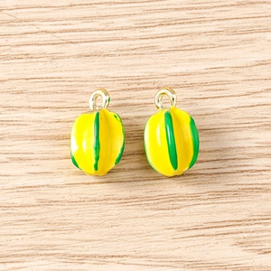Detail of 3D starfruit pendants in yellow and green for DIY jewelry making