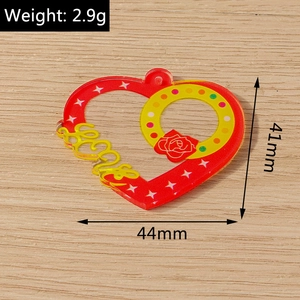 Detail showing red acrylic heart pendant with Love text and rose flower pattern