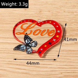 Detailed size view showing 44mm heart pendant with stars and butterfly accents