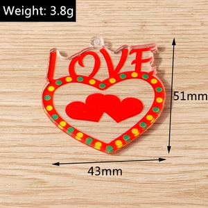 Macro view of acrylic heart pendant with LOVE lettering, 51mm by 43mm size details