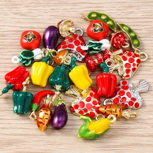 Macro shot of assorted colorful vegetable and mushroom charms for DIY jewelry making